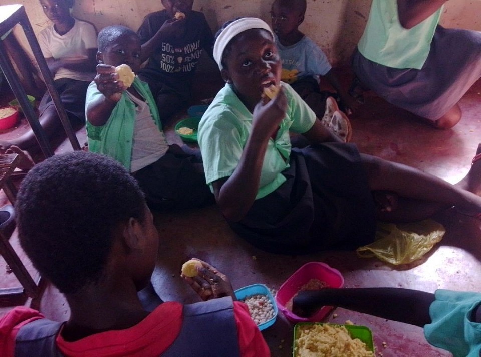 These children are sitting on the floor eating the local food called nshima made from yellow maize which is not good for human consumption.this is because we don't have food to give them.we am appealing for financial help from well-wishers around the world to help us building classrooms and sanitation facilities, we also facing challenges of laptops, clothes, football wear and food.the own going drought in Zambia has made it impossible to feed our students.your generosity and support will help us to over come some of the challenges we are facing.